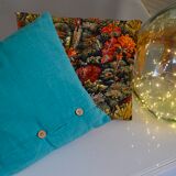 Scandinavian green cushion with wooden buttons