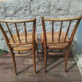 Set of 2 antique bistro chairs. Curved and turned wood.