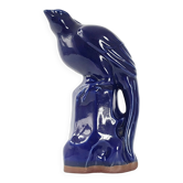 Bird on a vintage blue ceramic perch from the 1960s.