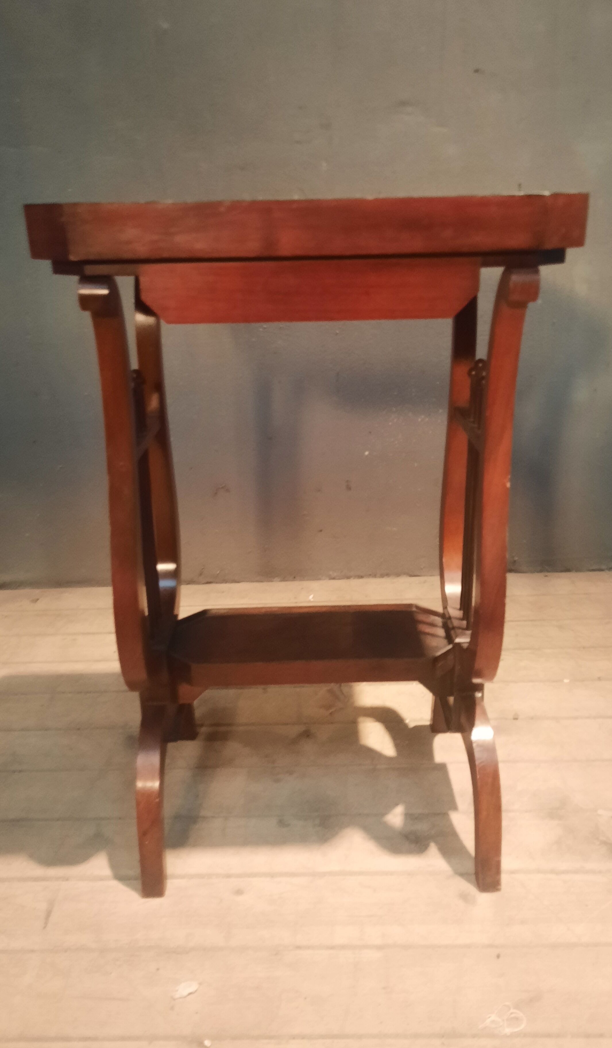 19th-century worker with a lyre footstool.