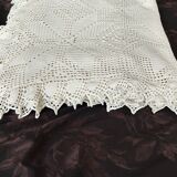 White cotton bedspread, crocheted sofa throw with star patterns
