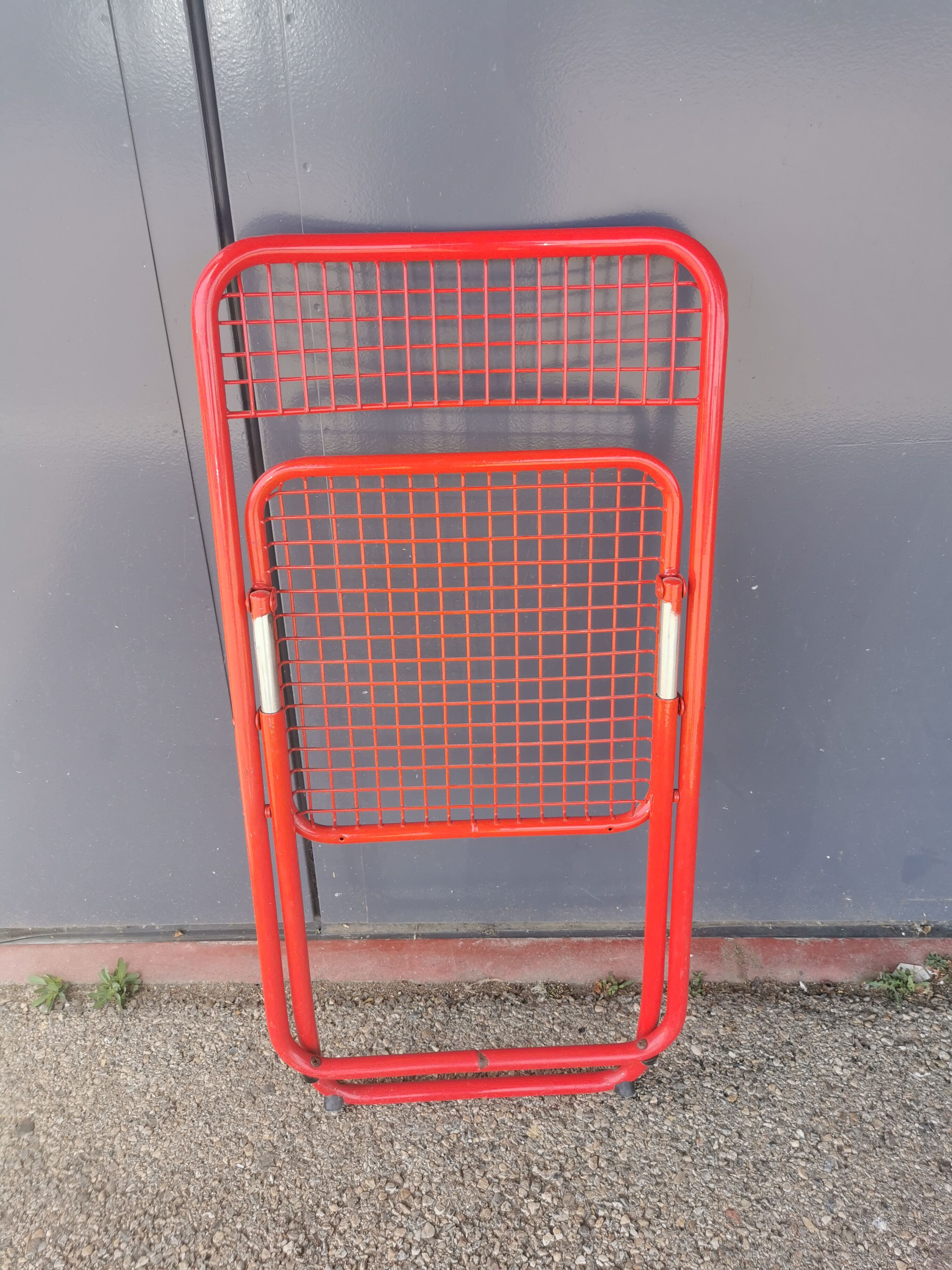 Vintage red metal folding chair