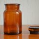 Small jar of amber glass apothecary with a flat cap