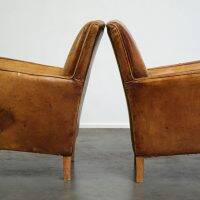 Set of English style light cognac colored leather armchairs.