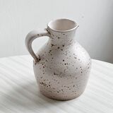 Pitcher, jar, jug in spotted stoneware.