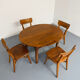 Oval dining table in solid wood with turned legs from the 1950s.