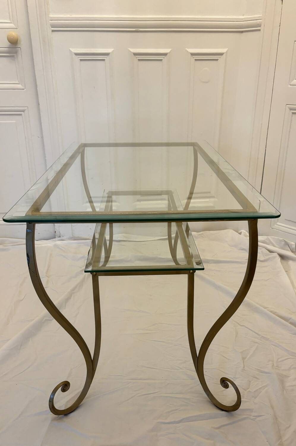 Large gold wrought iron and glass side table.