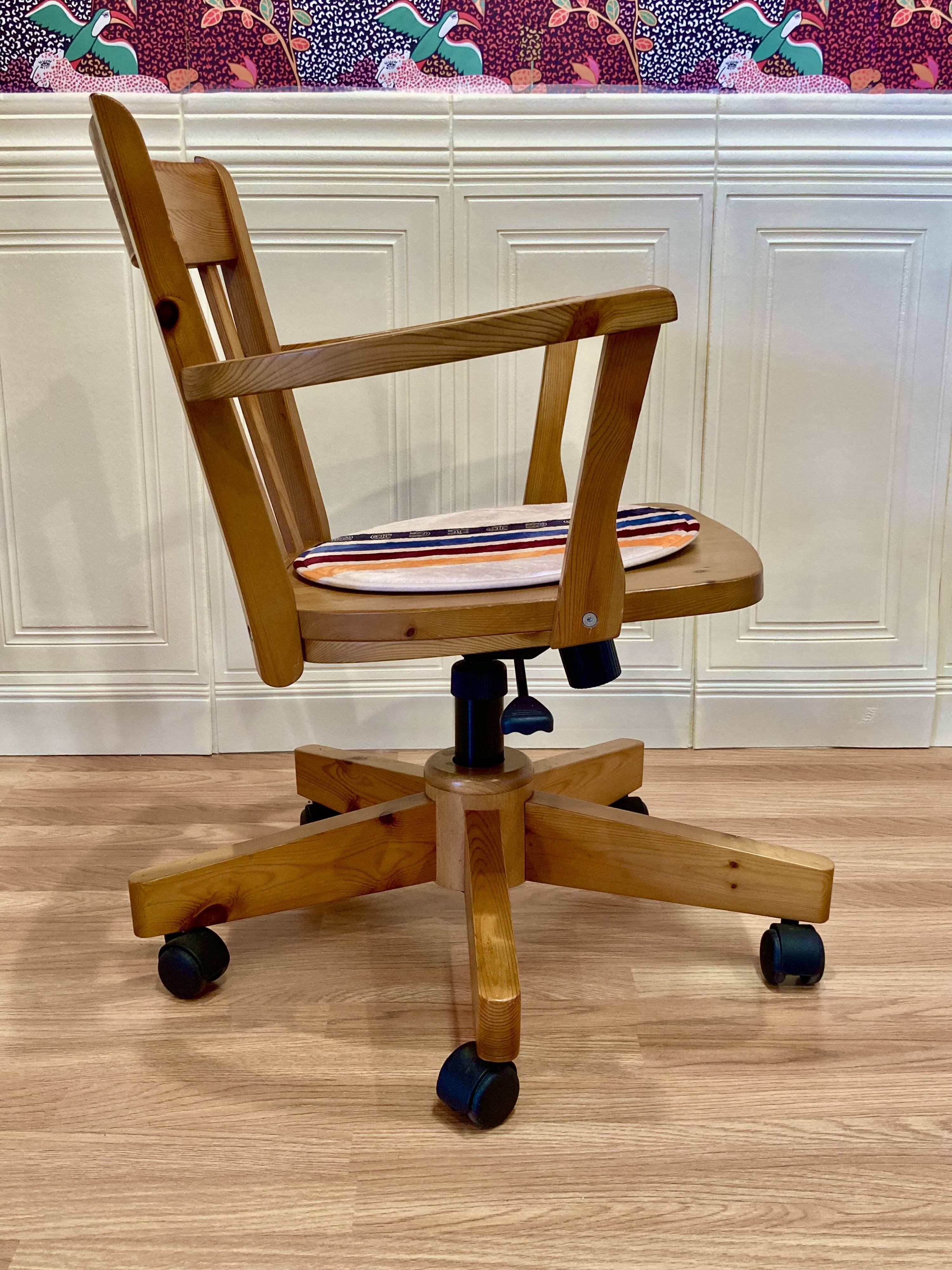 Solid wood swivel and reclining armchair.