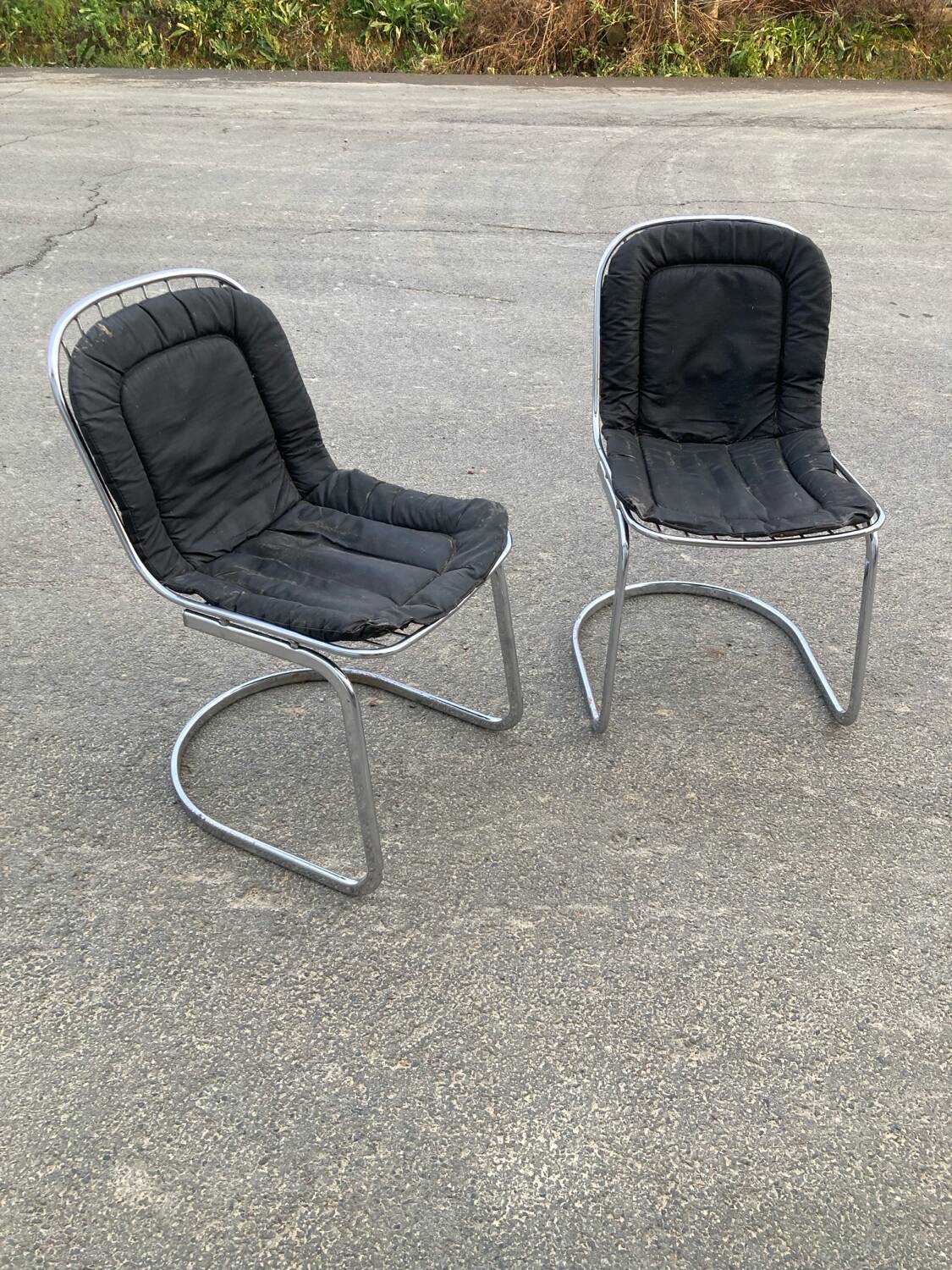 Two Gastone Rinaldi style chrome metal chairs.