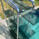Bauhaus style bookcase with modular wall shelf, glass and chrome
