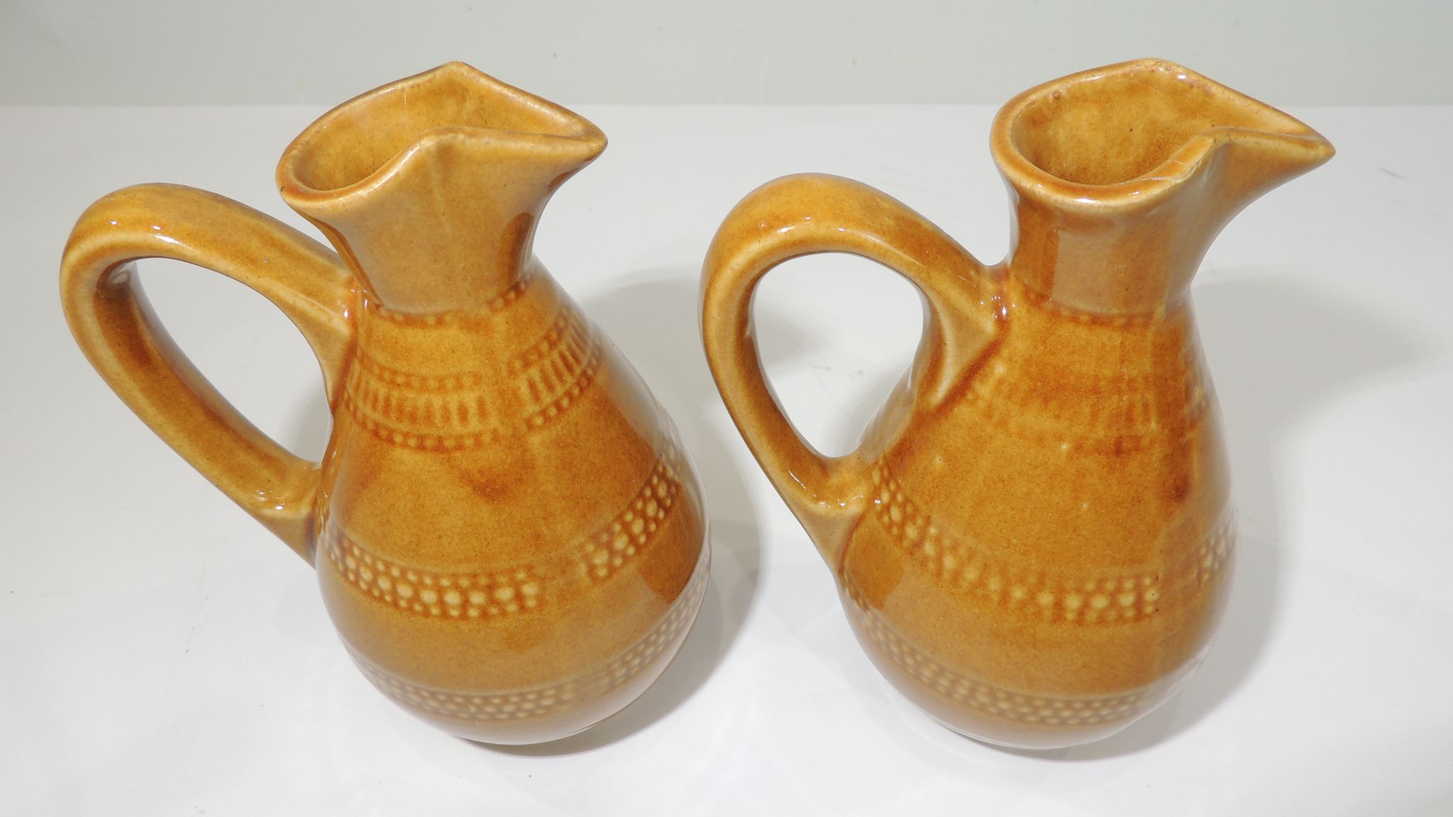 Pair of vintage stoneware pitchers