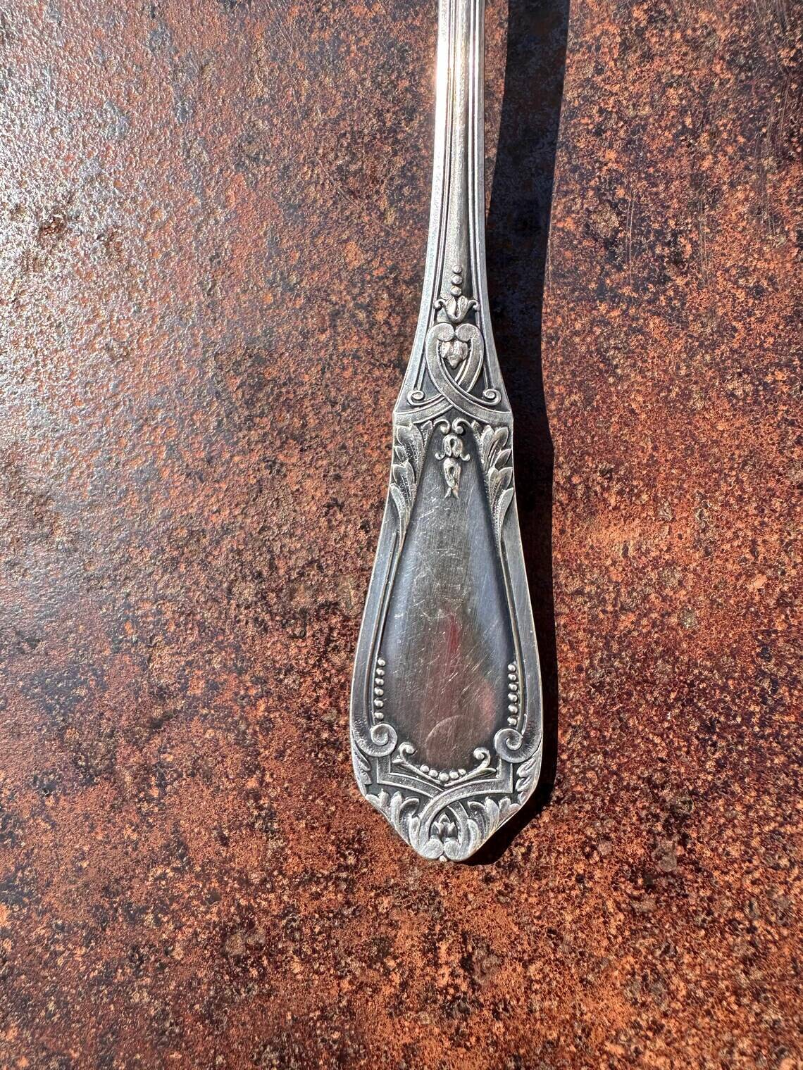 Strawberry spoon or antique Art Nouveau fruit salad in silver metal.