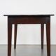 Antique French fruitwood dining table with 2 drawers and patina