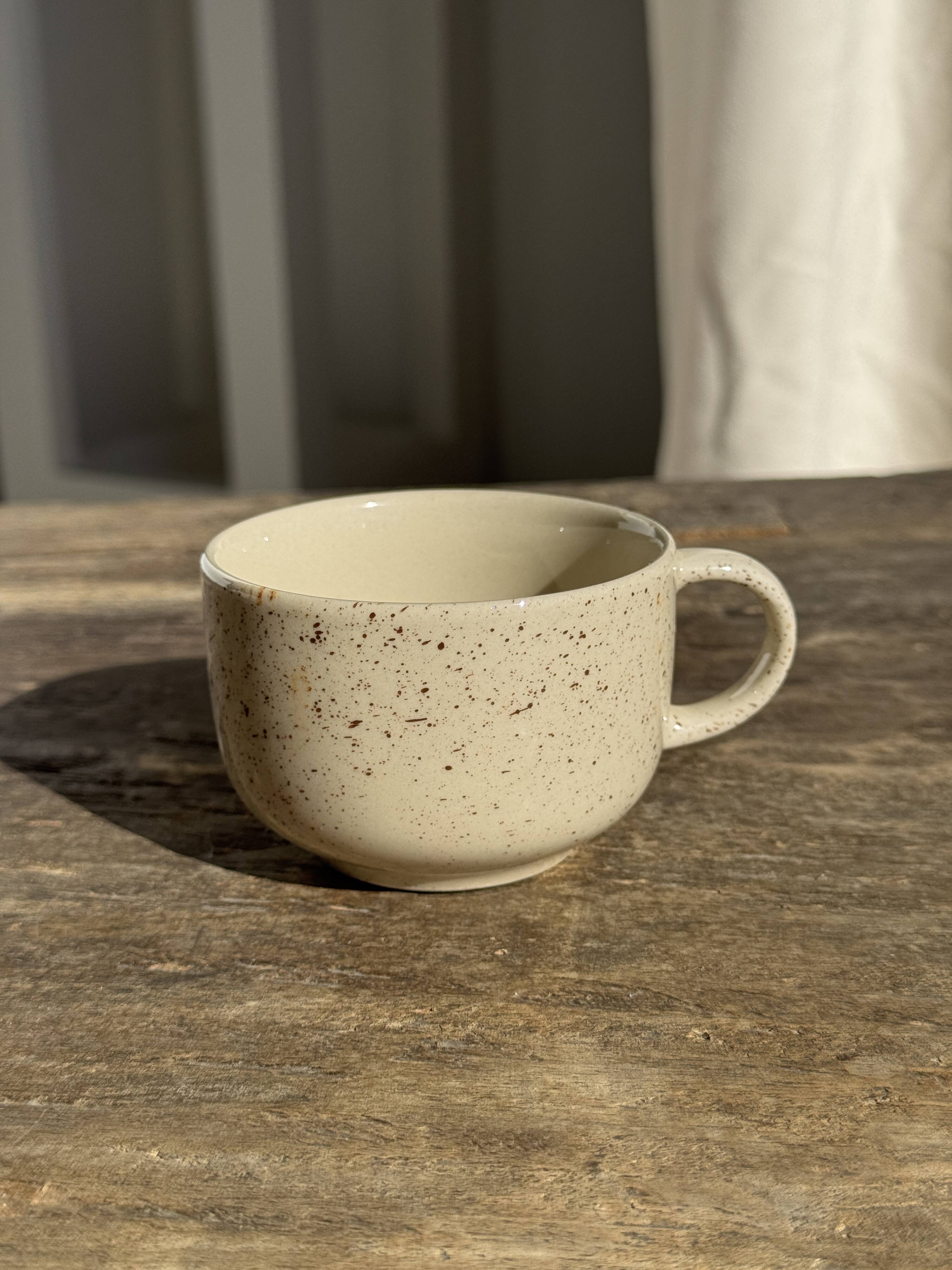 Set of 4 vintage speckled beige stoneware coffee cups.