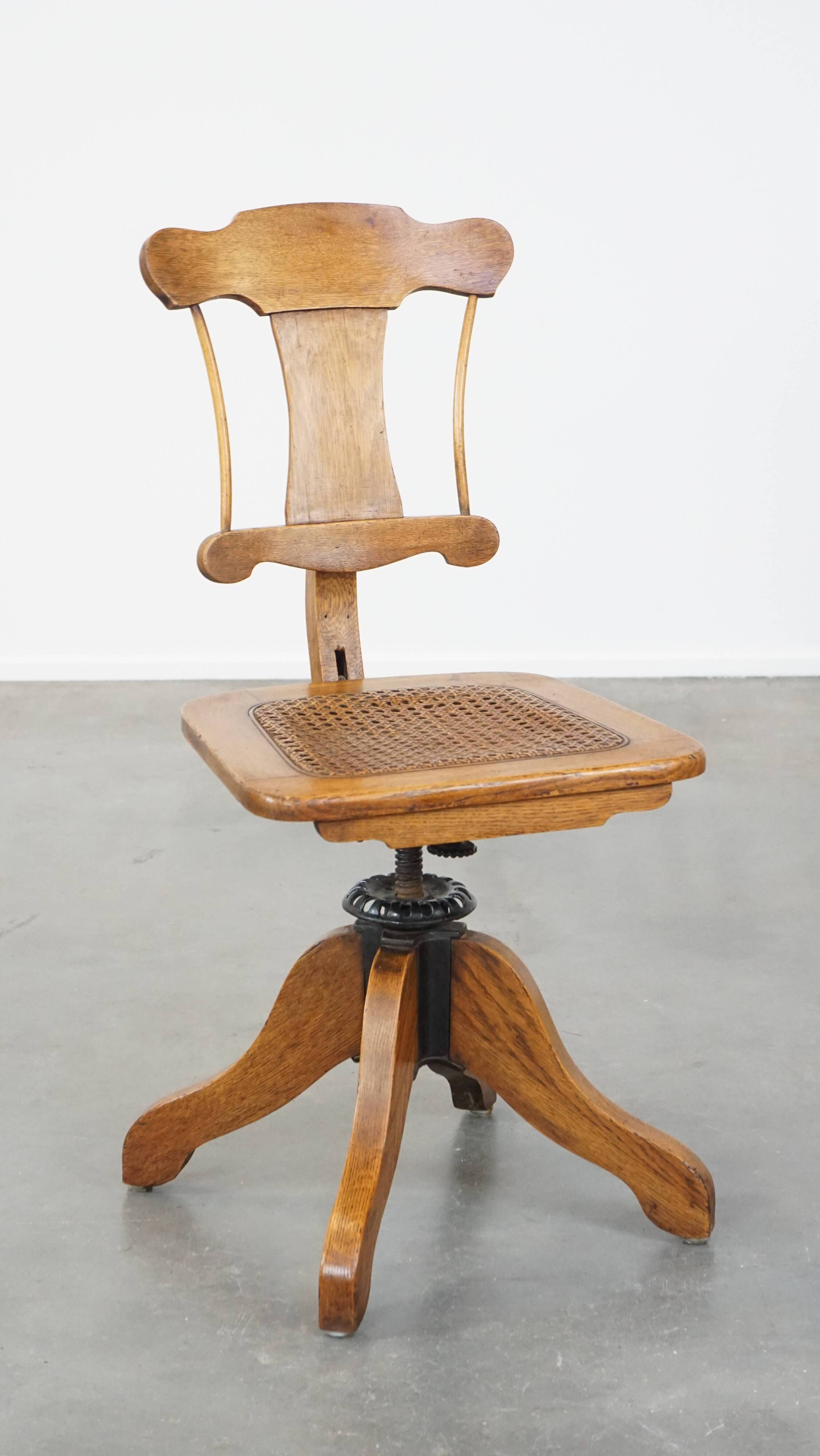 Antique late 19th century English office chair with reclining backrest and height adjustable