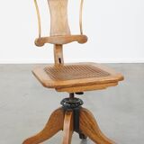 Antique late 19th century English office chair with reclining backrest and height adjustable