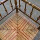19th-century solid wood corner chair with red and blue rush seating.