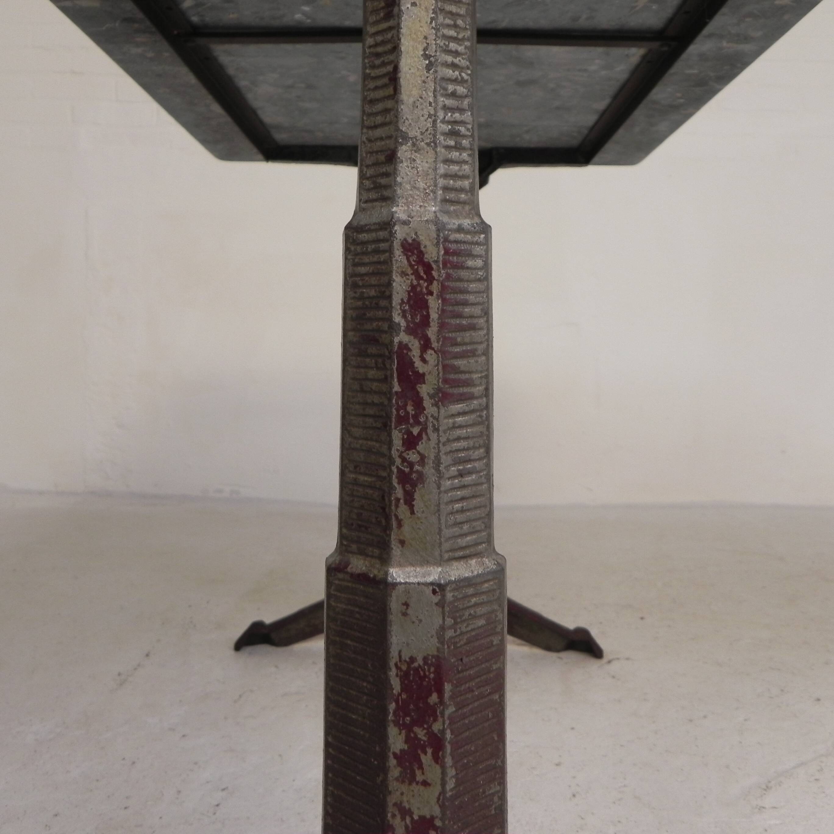 Bistro table with a marble top on a cast iron frame, 1930s.