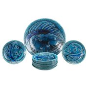 A stoneware bowl and 11 plates by Charlotte Hamilton, Sweden, 1970, Signed