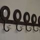 Iron coat holder with picture frames