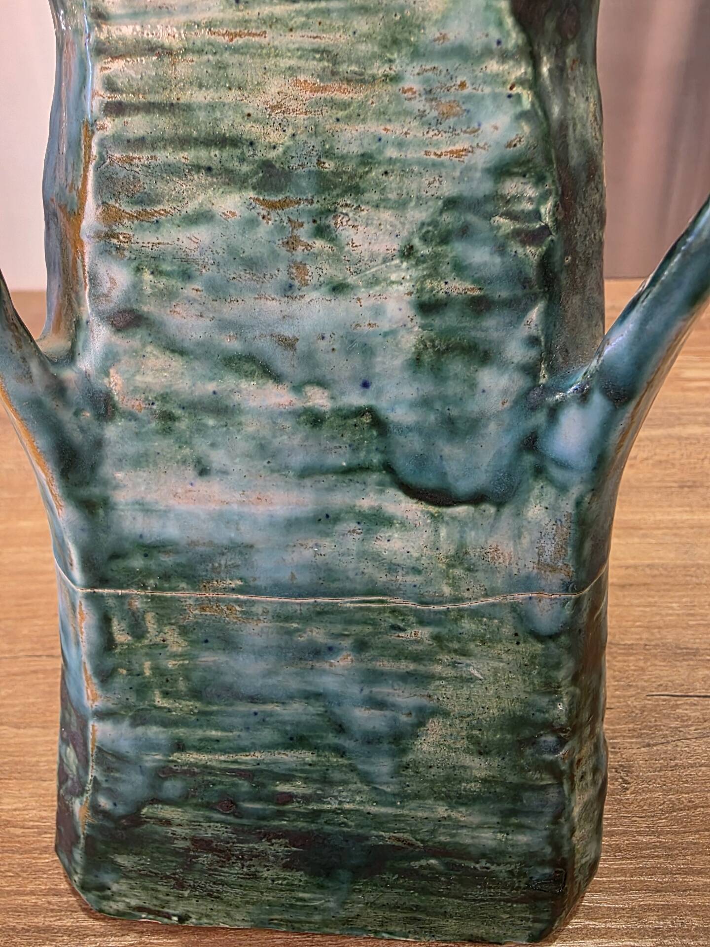 Vintage brutalist ceramic vase with 4 green handles.