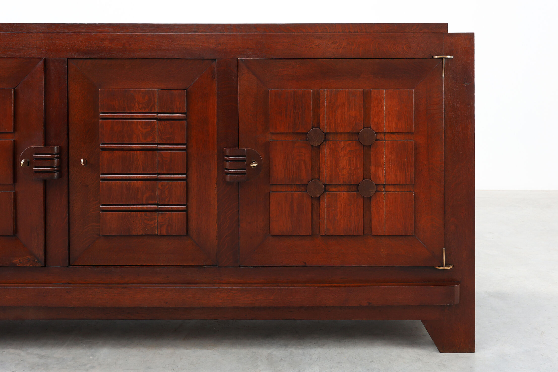 Art Deco carved geometric sideboard by Charles Dudouyt in oak, France ca. 1