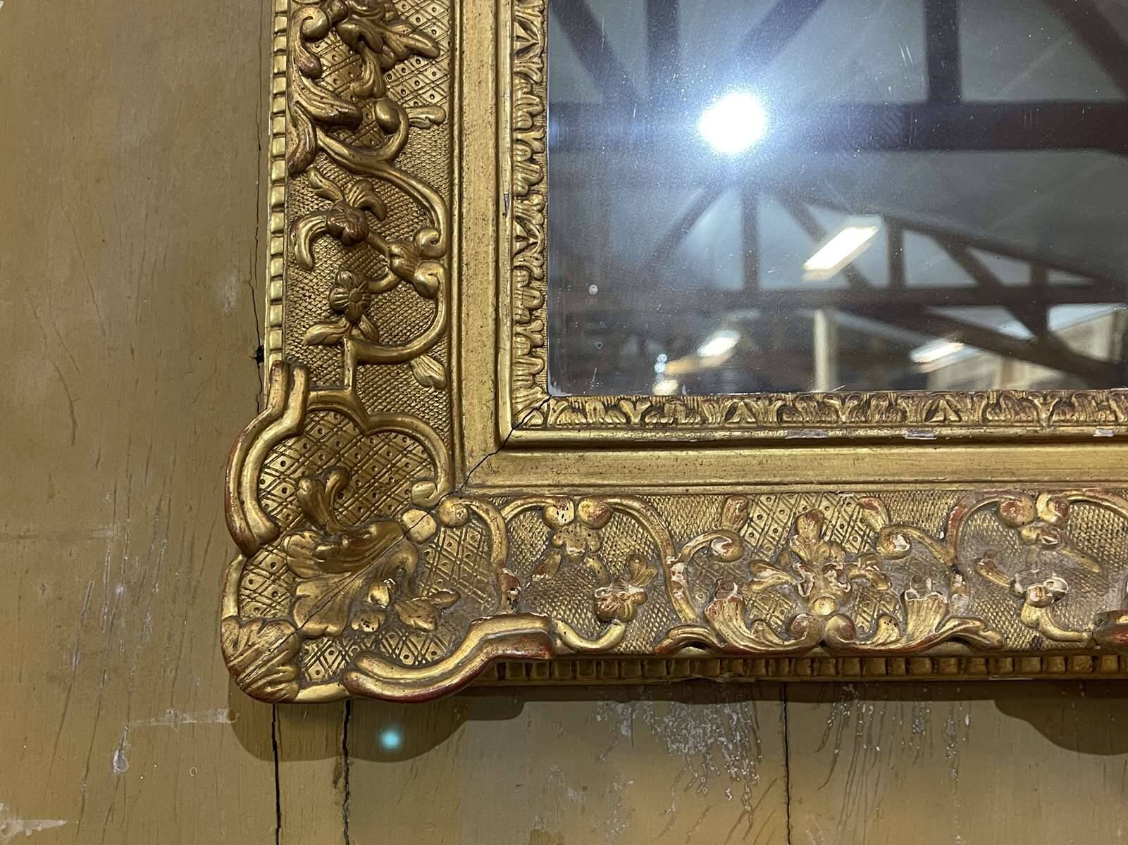18th century Regency mirror in gilded wood