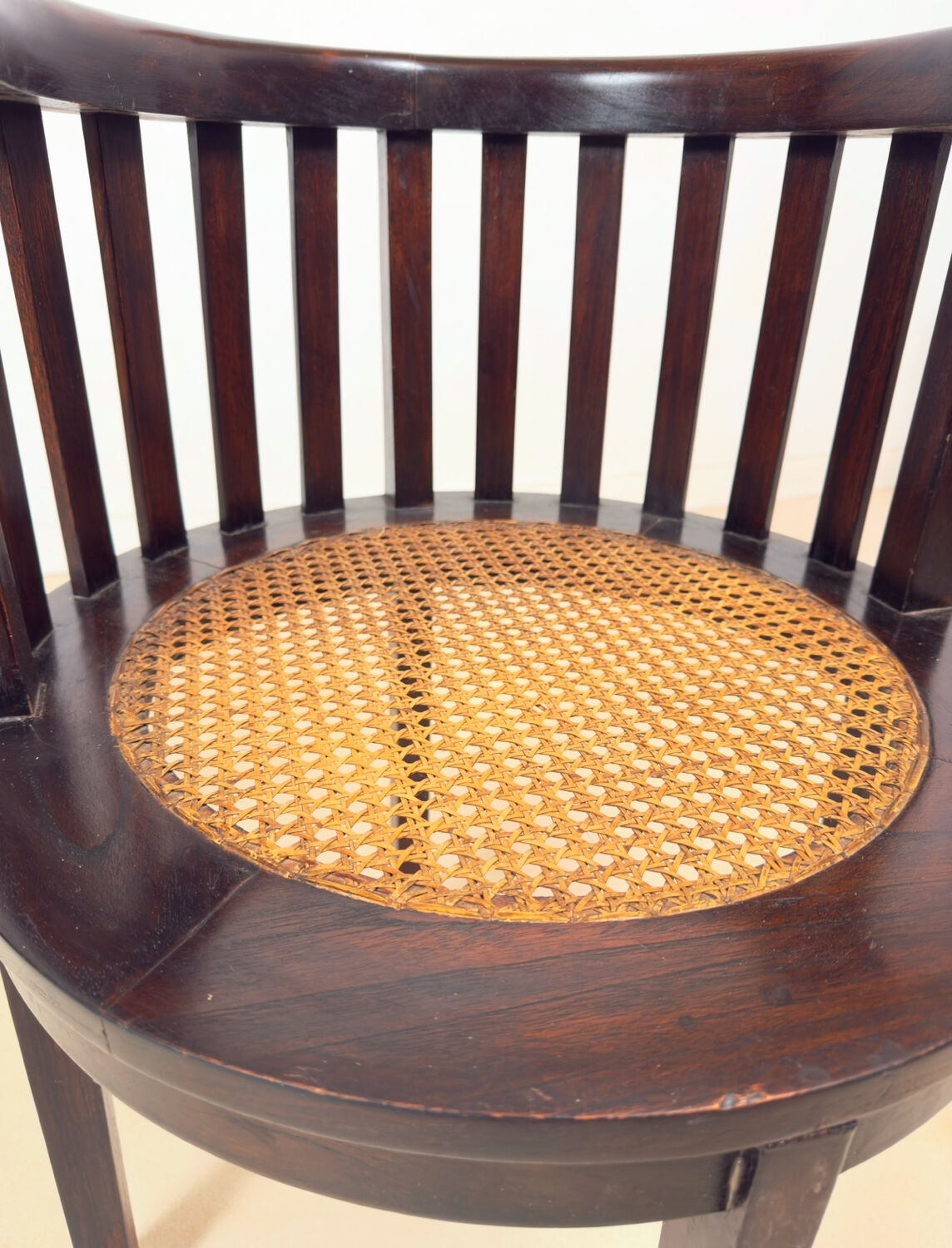 Colonial "Art Deco" armchair in wood and cane.