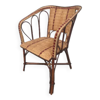 Bistro-type armchair in woven rattan and red edging