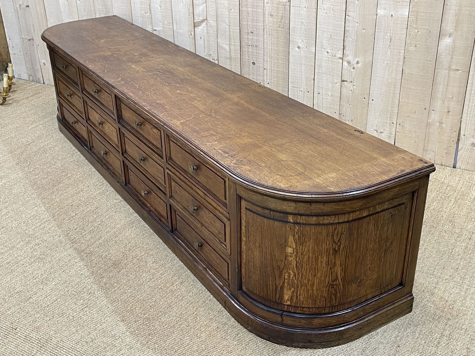 Long low oak countertop with 12 drawers - early XXth