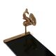Wall shelf in gold metal and black glass adorned with fish.