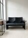 Small vintage black faux leather sofa