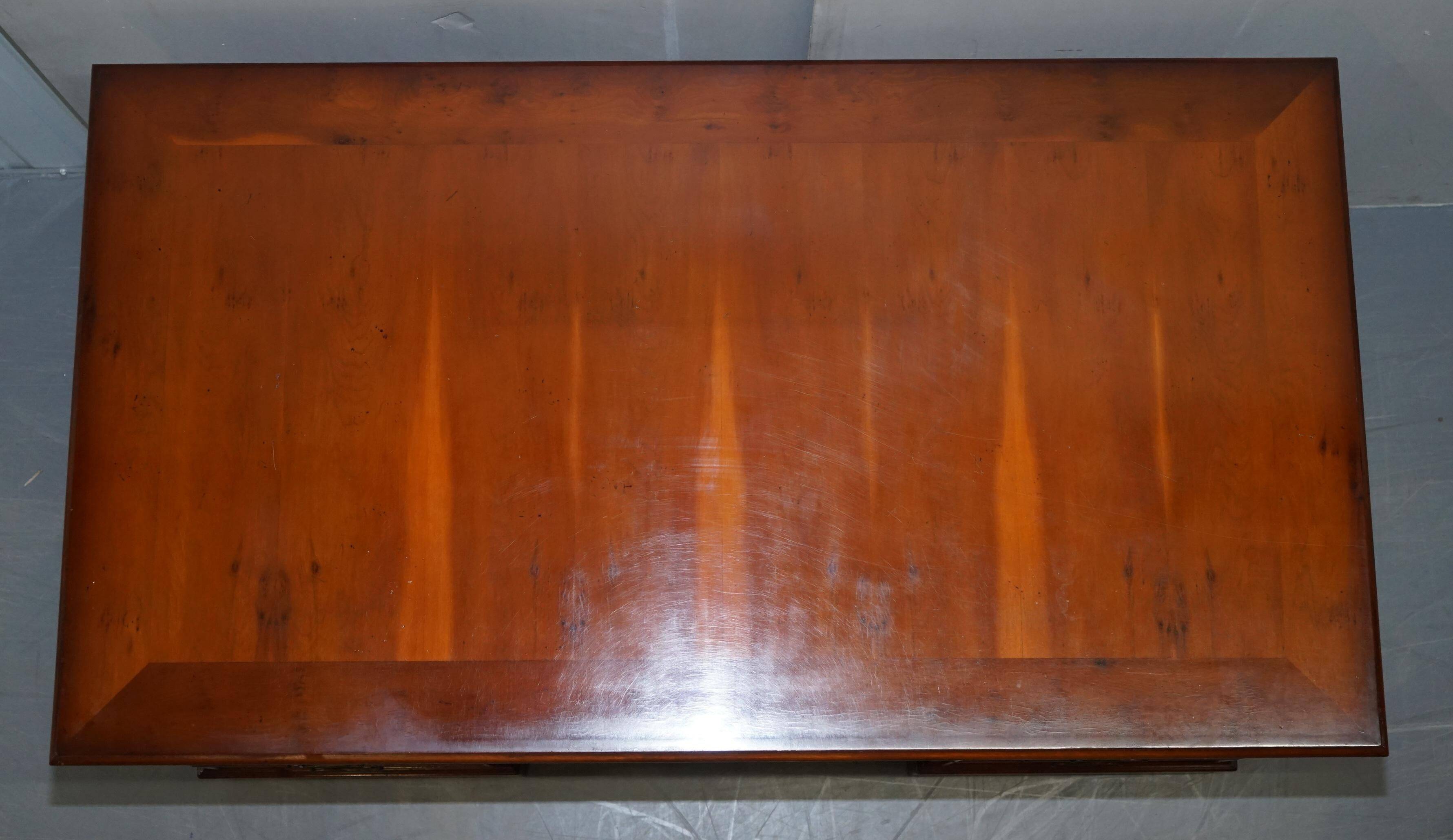 Partner desk with double pedestal in burr yew wood with decorated top.