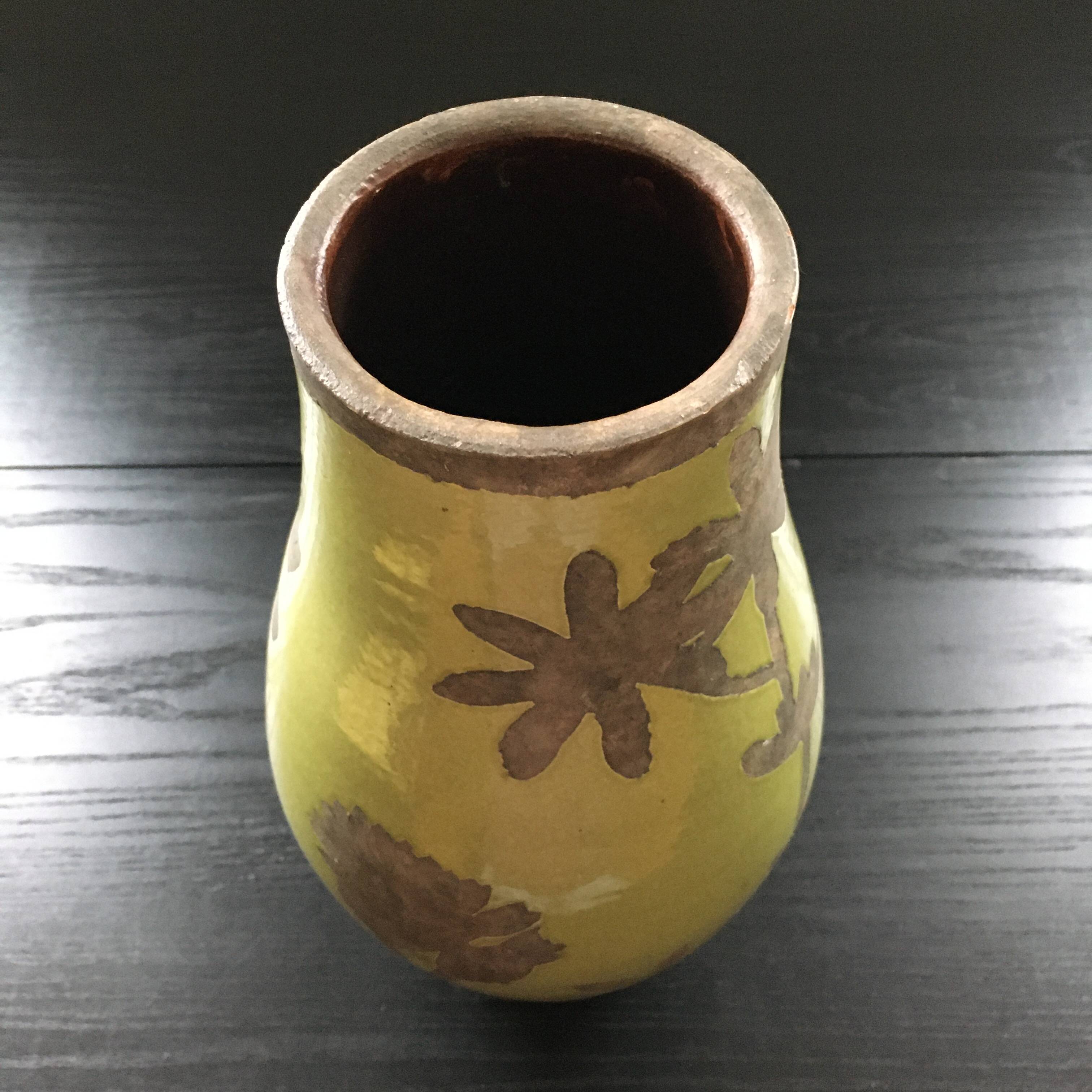 Large green vase with floral decoration