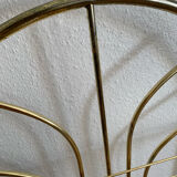 Gilded metal grid shelf in the shape of a vaulted arch