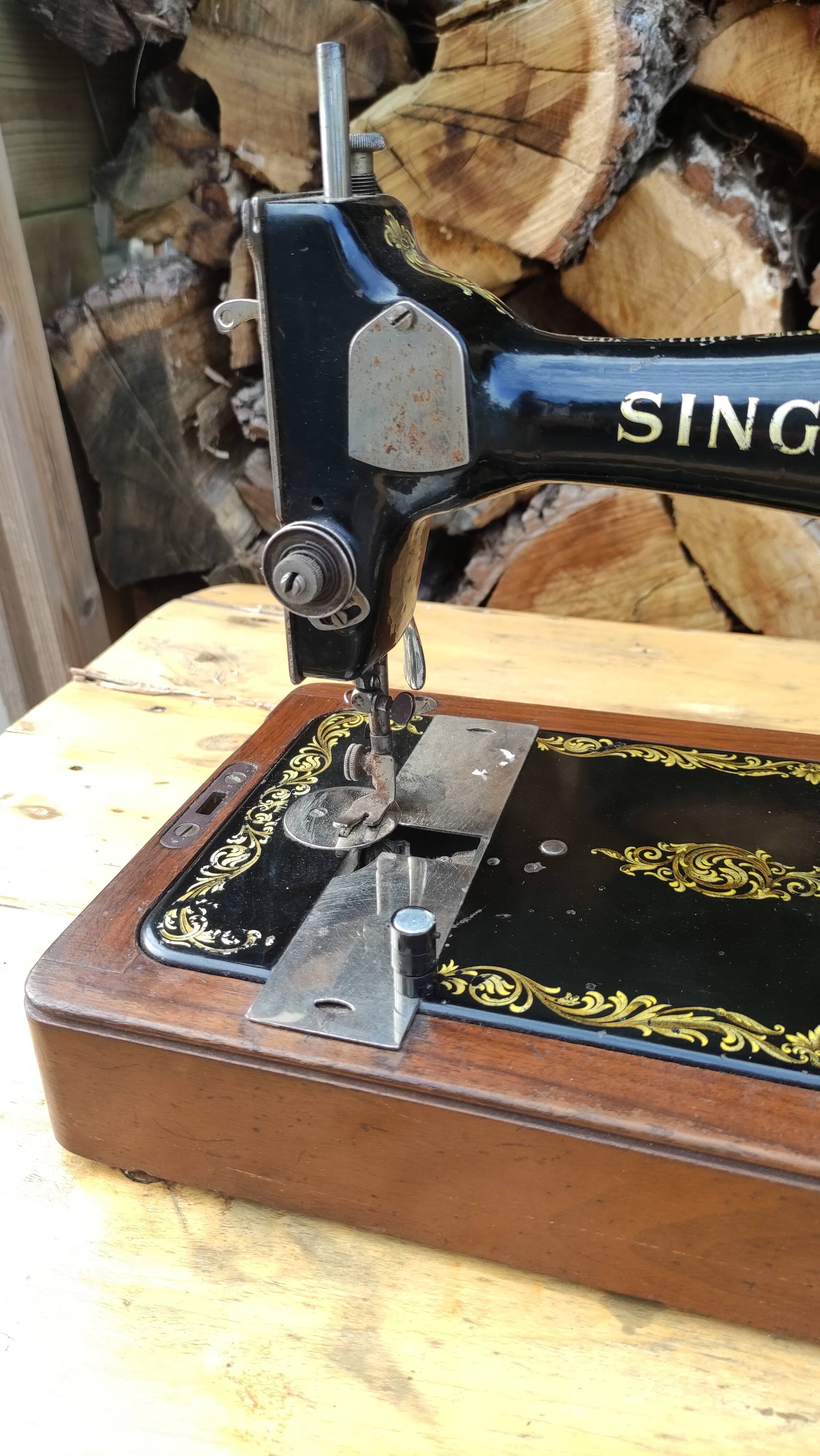 Old Singer sewing machine on its original base