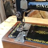 Old Singer sewing machine on its original base