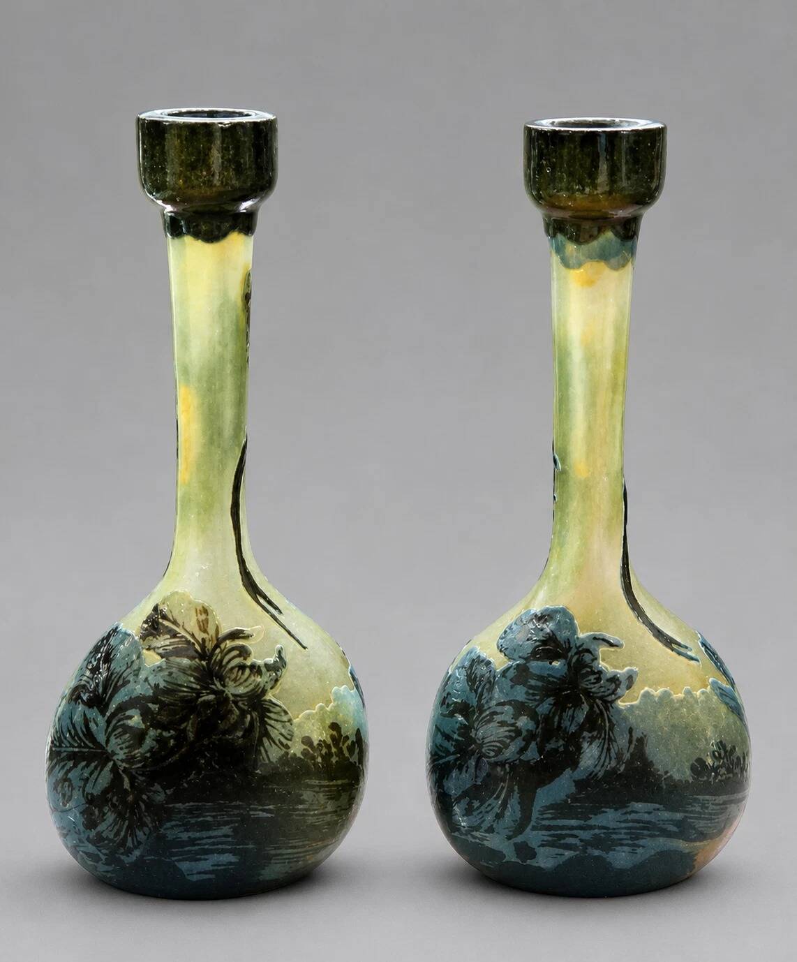 Pair of flower vases in glass paste, with a long slender neck.
