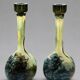 Pair of flower vases in glass paste, with a long slender neck.