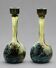 Pair of flower vases in glass paste, with a long slender neck.