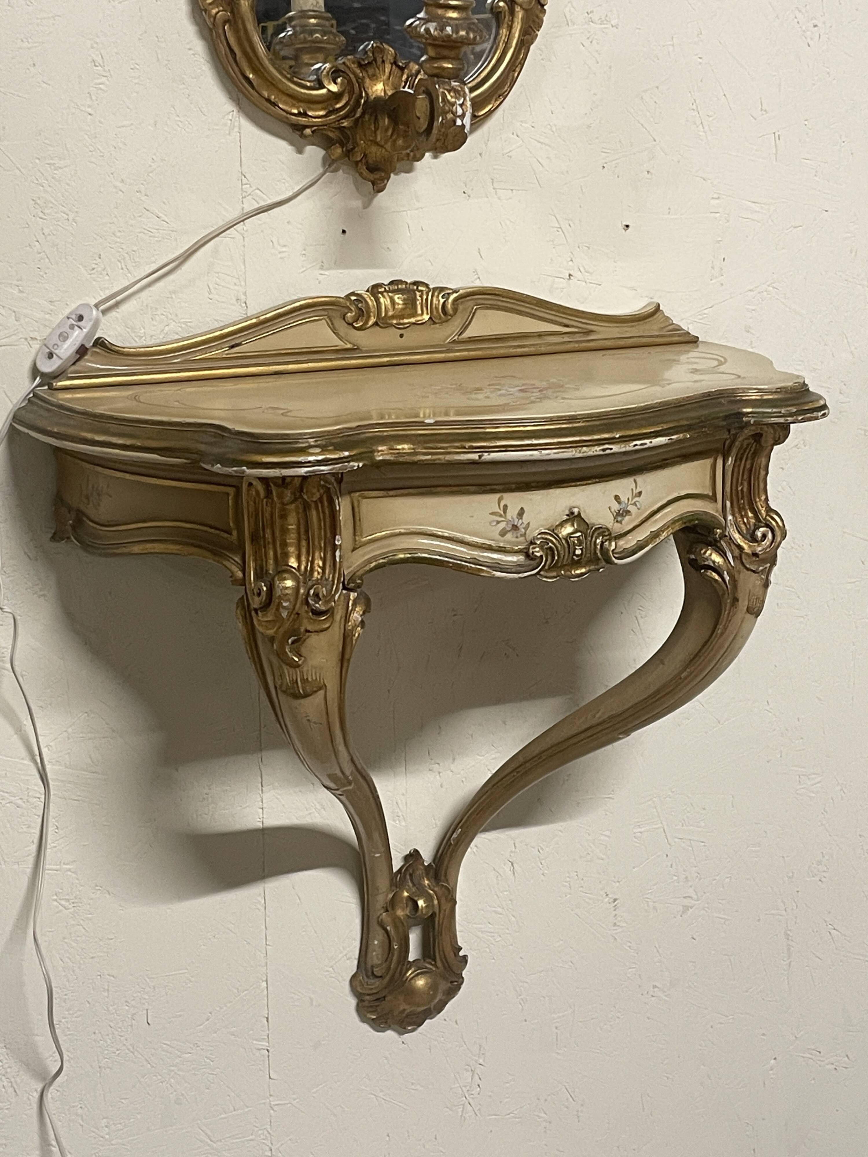 Pair of wall-mounted consoles with a mirror in Louis XV style.