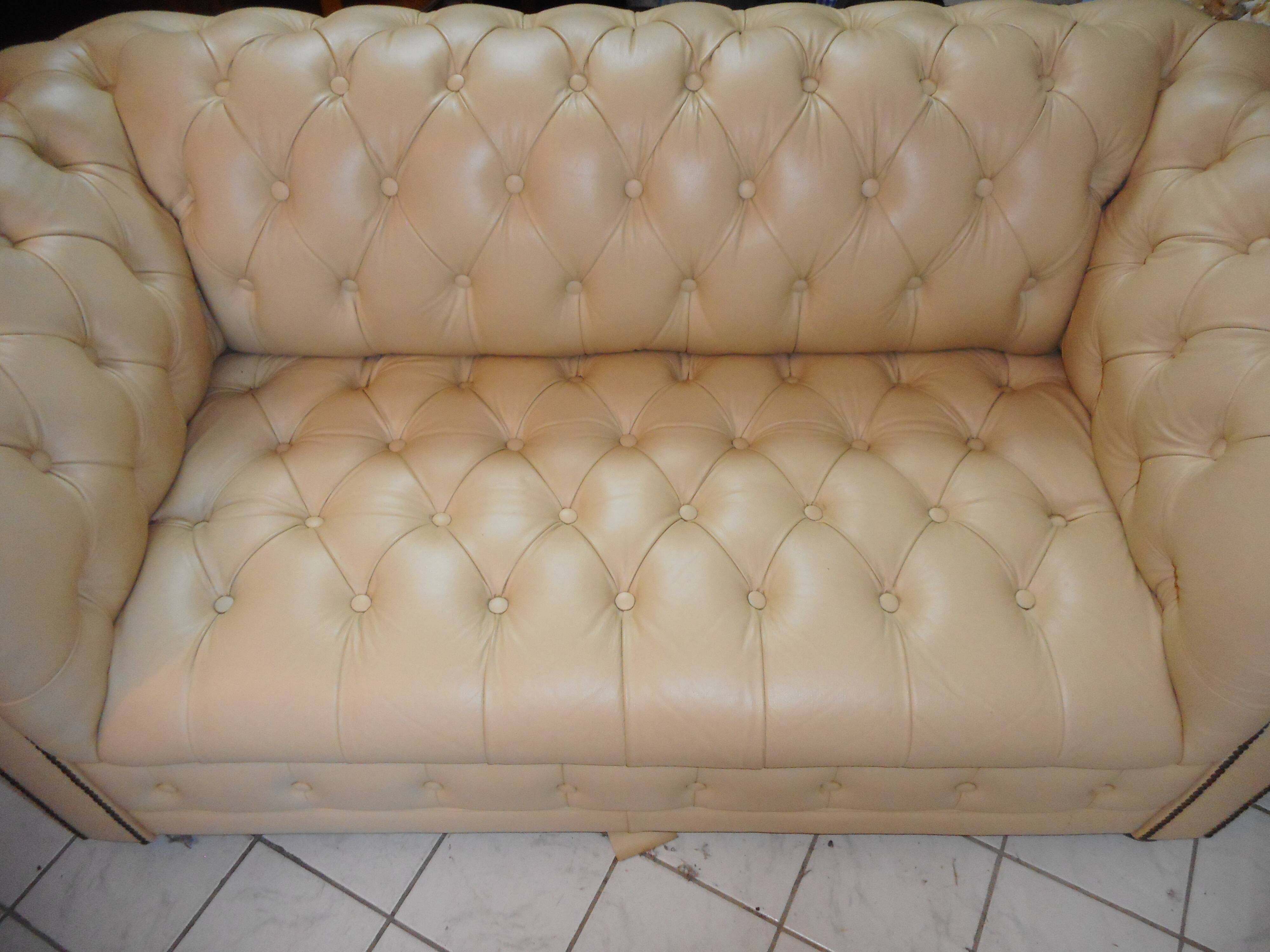 Beige leather chesterfield sofa