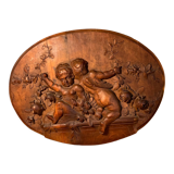 Bas relief en bois sculpté