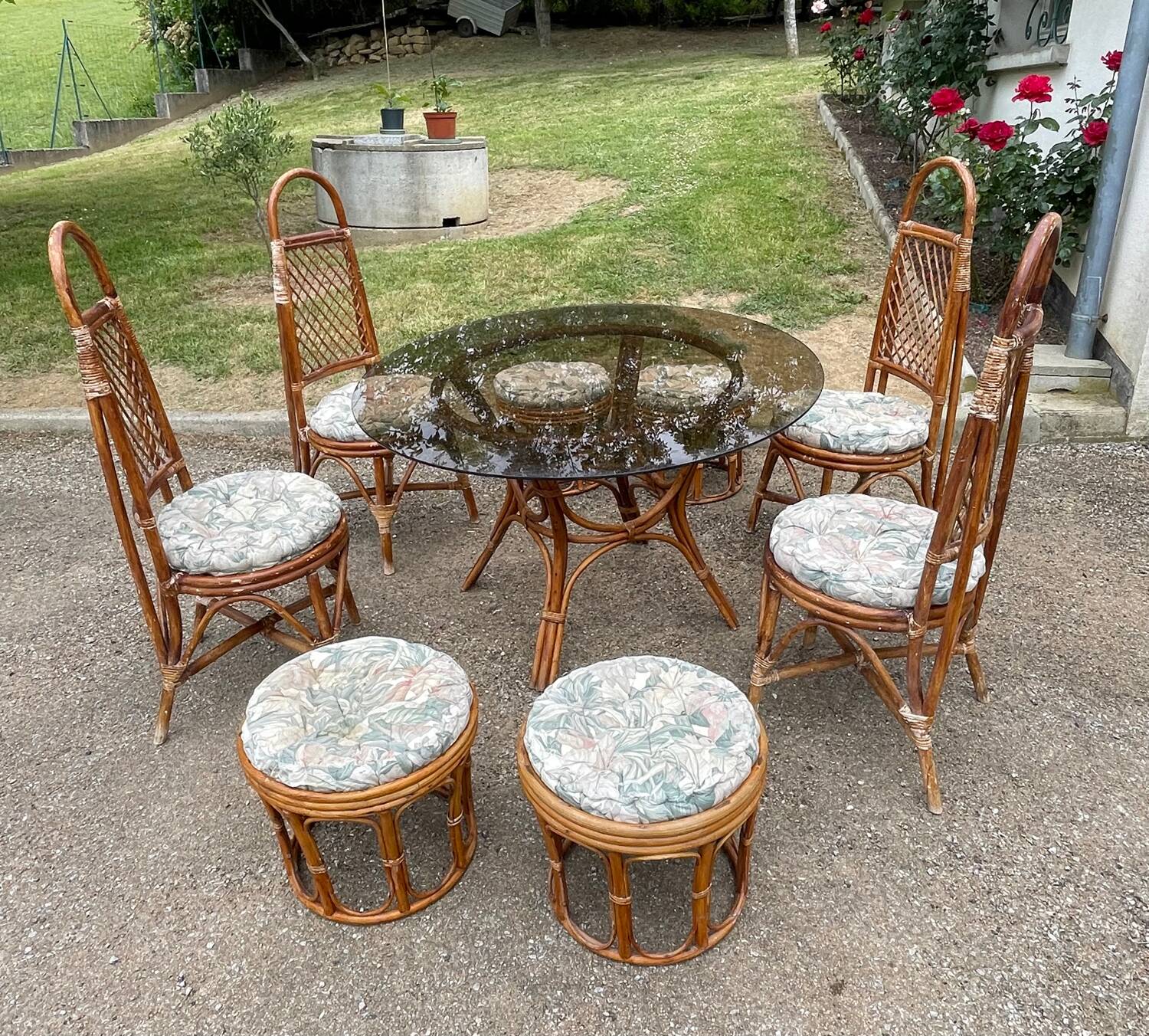 Vintage rattan dining set with glass table, 4 chairs and 4 stools.
