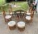 Vintage rattan dining set with glass table, 4 chairs and 4 stools.