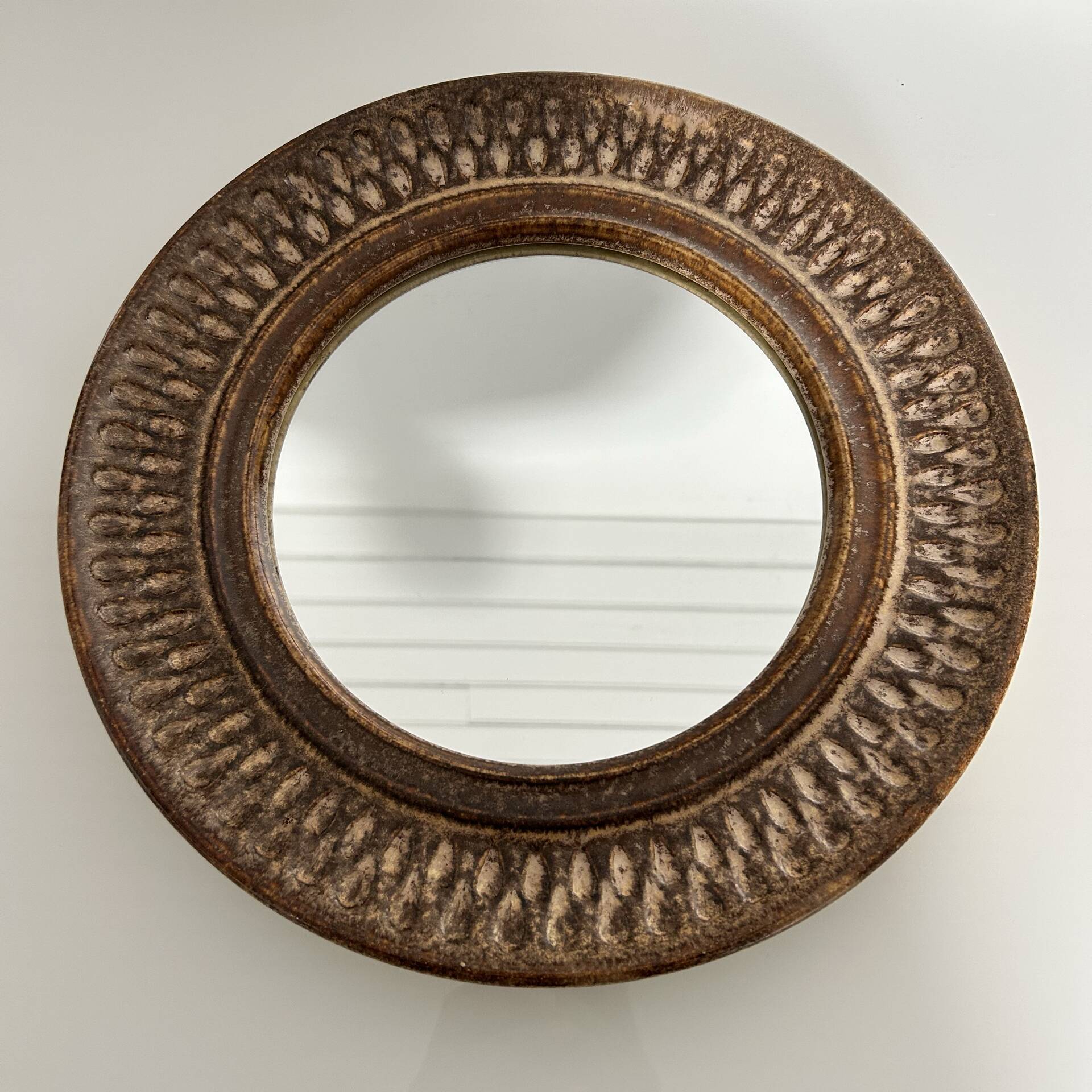 Chiselled stone mirror