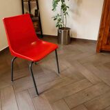 Pair of red plastic chairs with metal frame