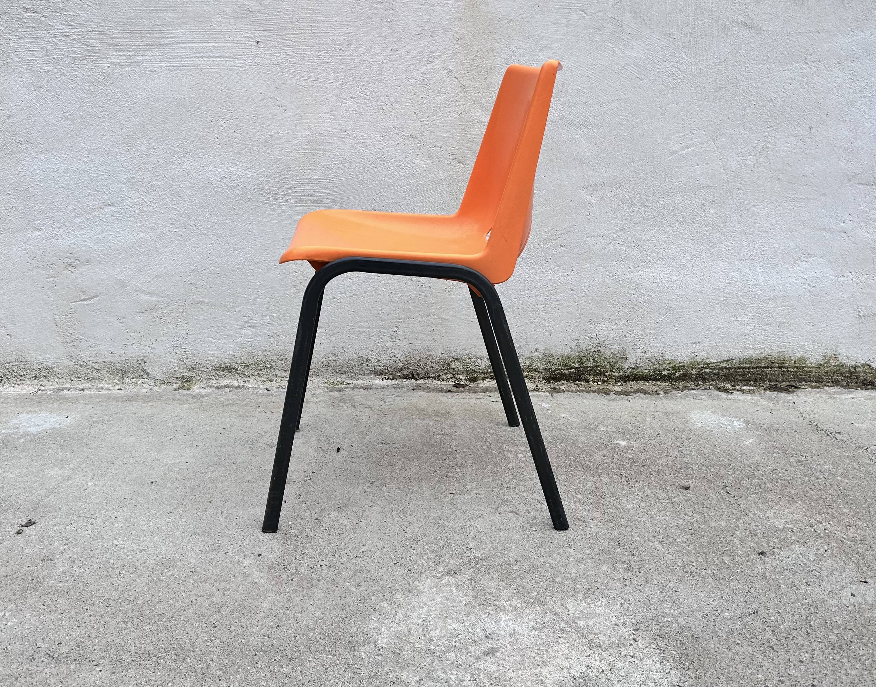 Orange plastic shell chair
