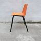 Orange plastic shell chair