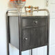 Vintage bedside table in brushed metal